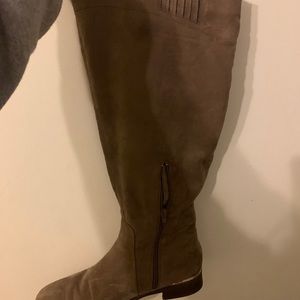 Brown boots with gold liner on back